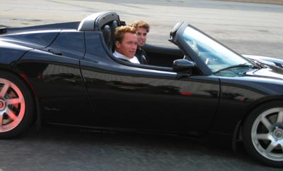 arnold in a tesla roadster